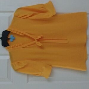 A CeCe bright merry gold blouse.  Size XS.